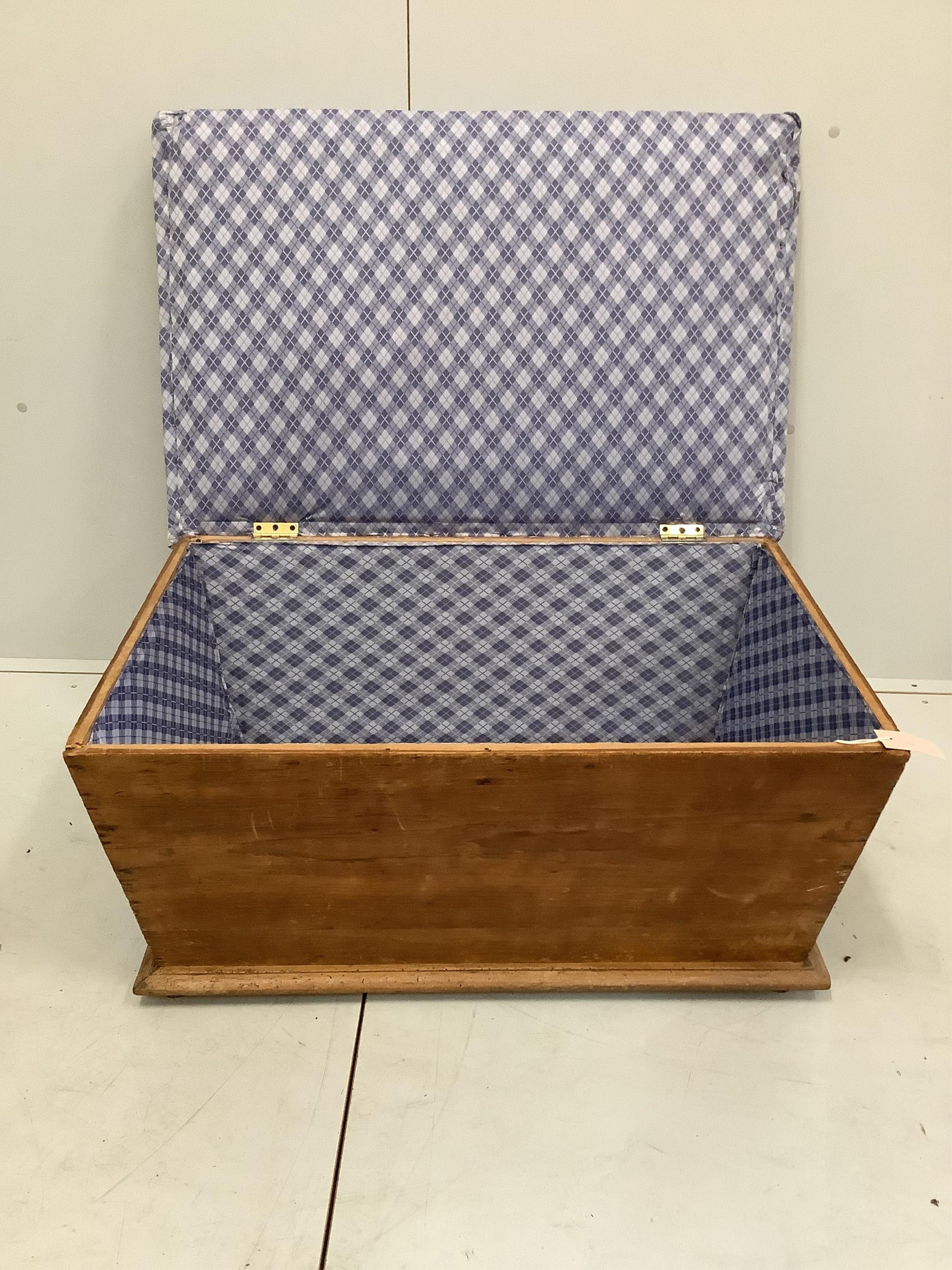 A Victorian pine ottoman with upholstered hinged seat, width 88cm, depth 56cm, height 42cm